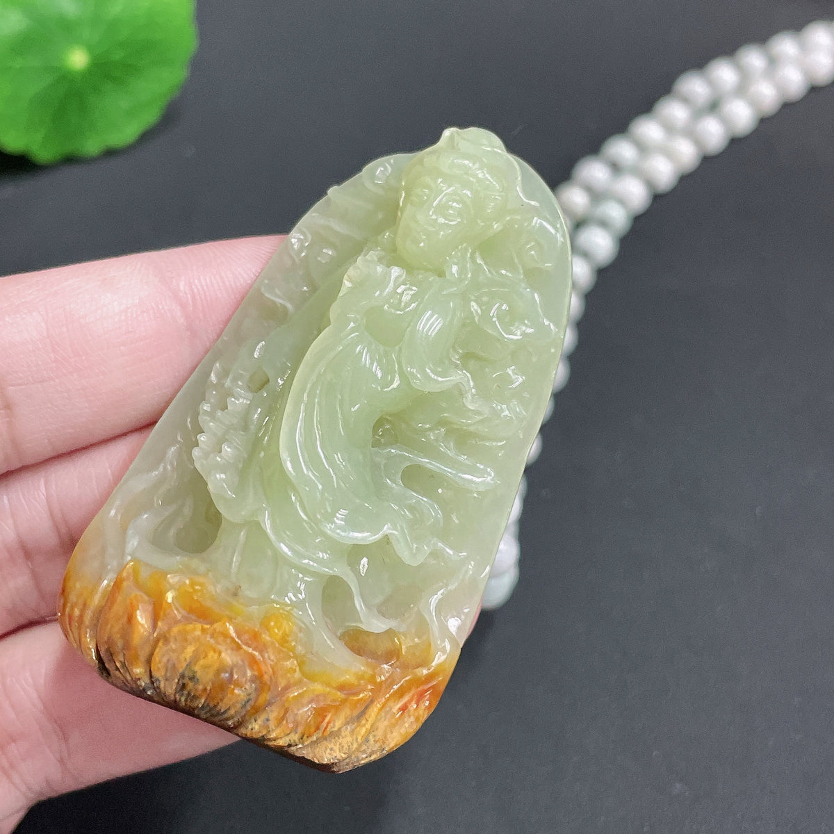 Huiliu Certified Khotan jade Guanyin pendant with chain, featuring smooth green jade carving of Guanyin deity, on a delicate chain.