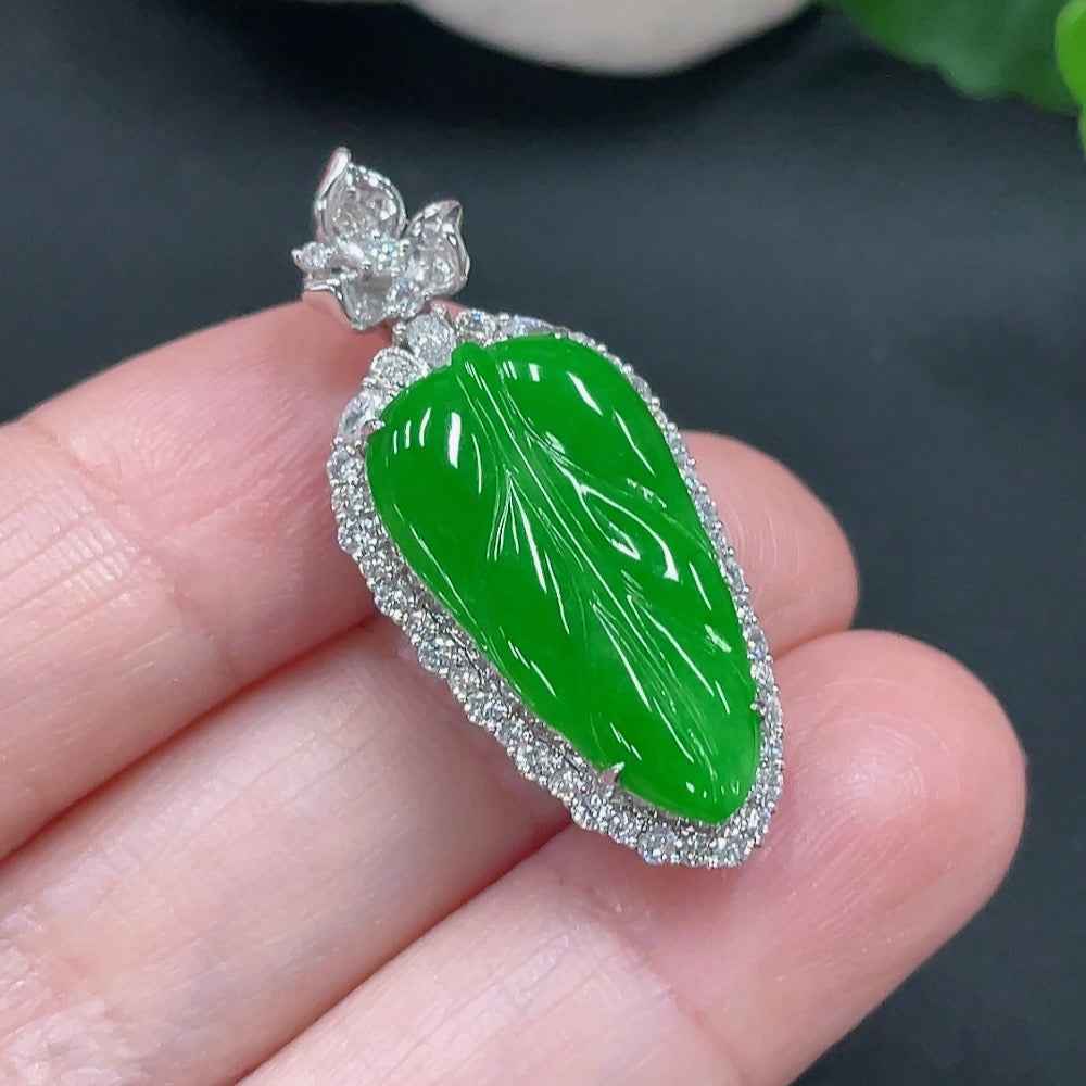 Natural Grade A jadeite leaf pendant in 18K gold setting, HUILIU certified, showcasing detailed leaf design and polished finish.