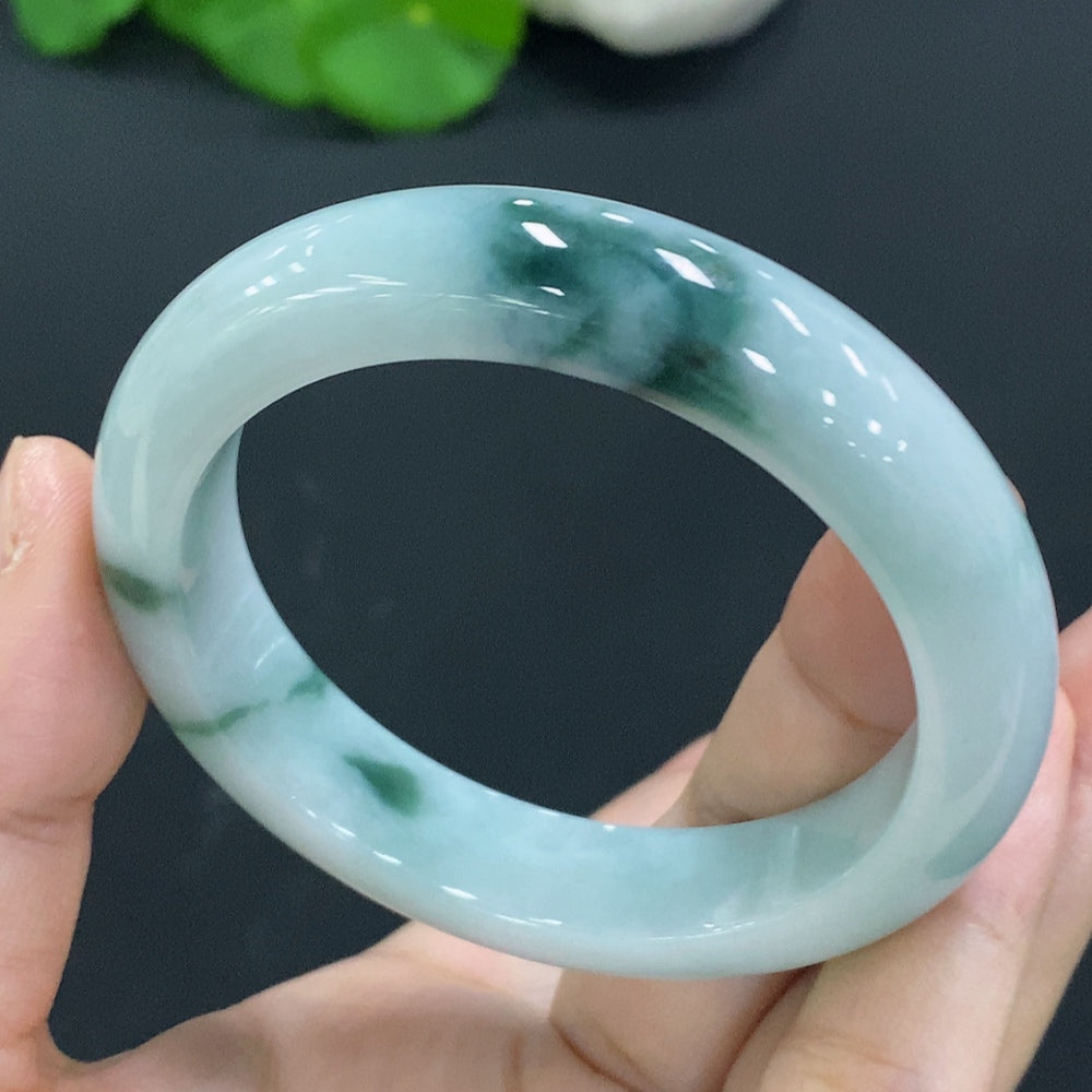 Natural Grade A jadeite bangle from HUILIU HQ, size 53.9, weighs 56.9g, with Huiliu certification, showcasing smooth, polished jade.