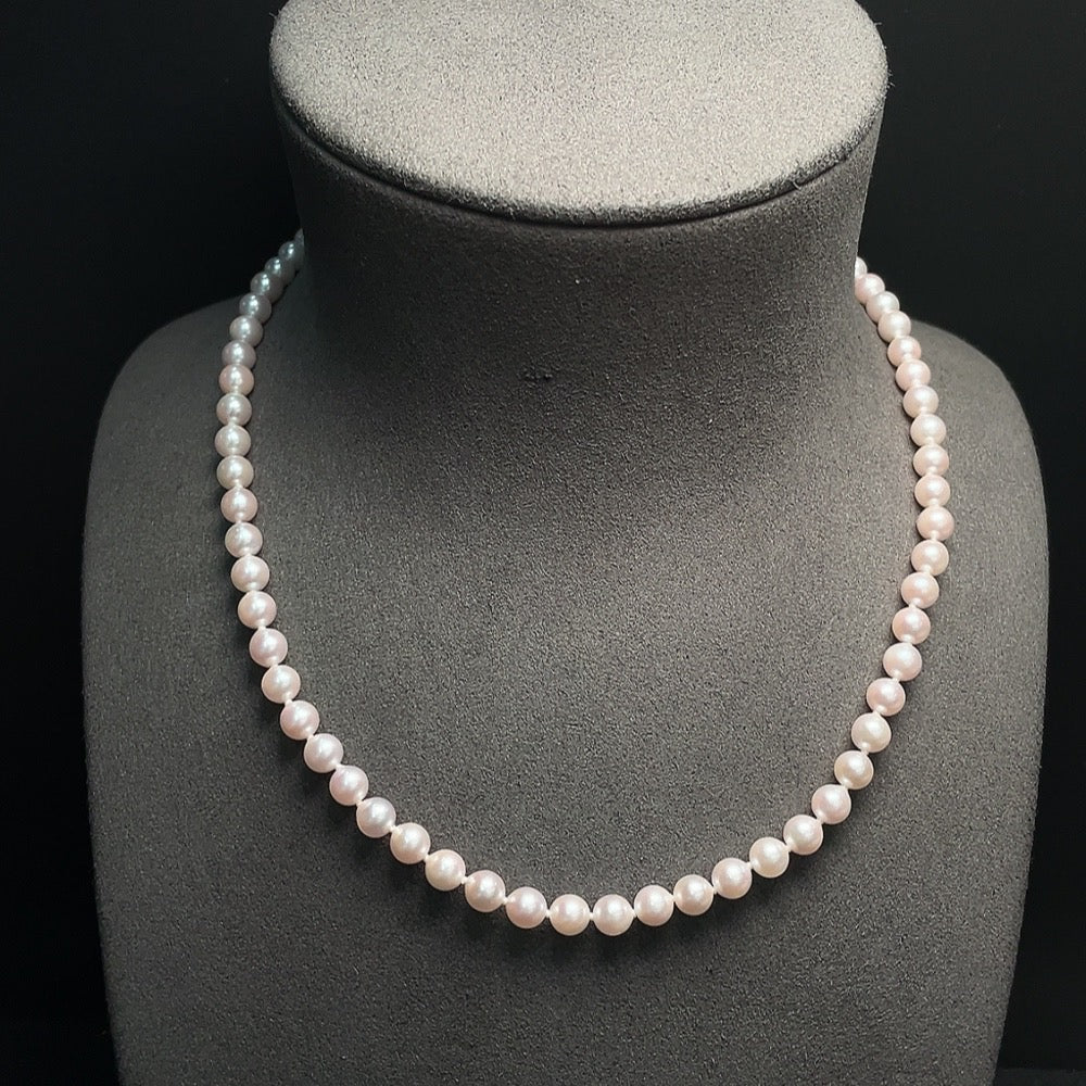 Seawater pearl strand with 5.8mm pearls in a non-gold setting, weighing about 20.85g, by HUILIU HQ.