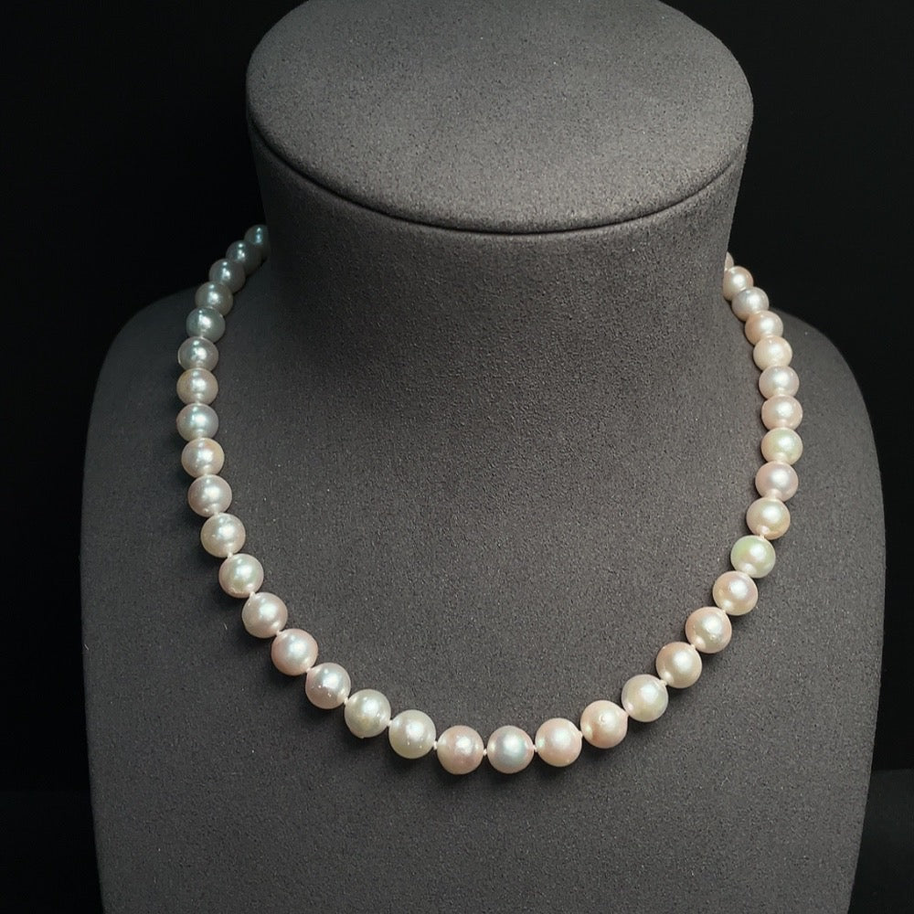 Seawater pearl strand by HUILIU HQ featuring 7.9mm pearls in a non-gold setting, total weight approximately 38.89g.