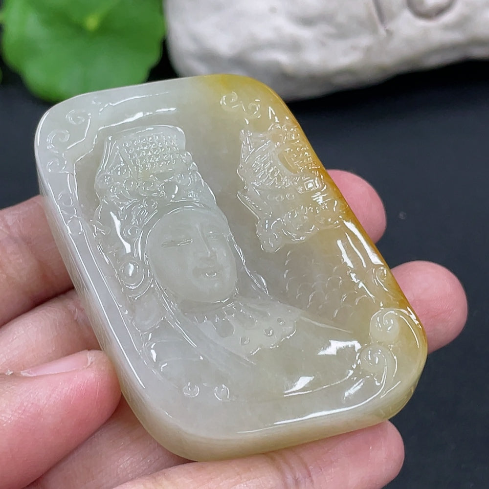 Jadeite Guanyin pendant from HKHQ, intricately carved in jade, weighing approximately 64.7g, showcasing detailed craftsmanship.