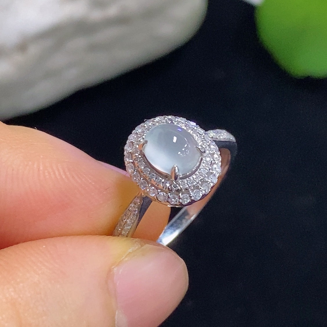 Jadeite cabochon solitaire ring with 18K gold band and diamond accents, elegant jewelry piece by HKHQ.