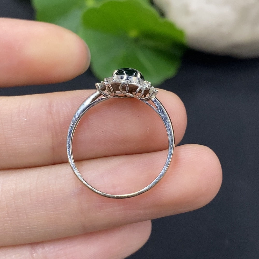 HUILIU HQ jadeite cabochon ring with diamond accents, showcasing a polished green jade gemstone on a silver band.