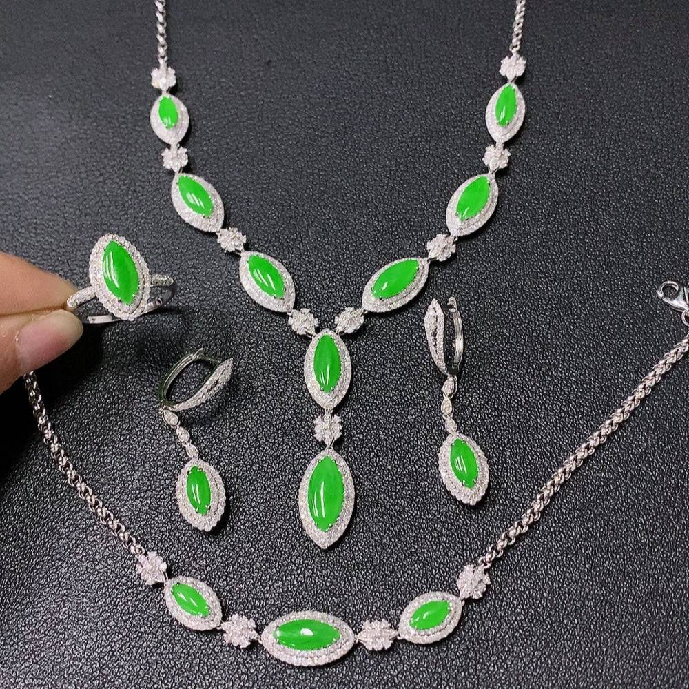 Jadeite jewelry set with necklace, bracelet, earrings, and ring featuring 18k gold and diamond accents, crafted by HUILIU HQ.