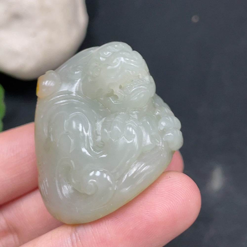 Huiliu certified Hetian jade pendant featuring an auspicious beast design with undetermined skin color formation.