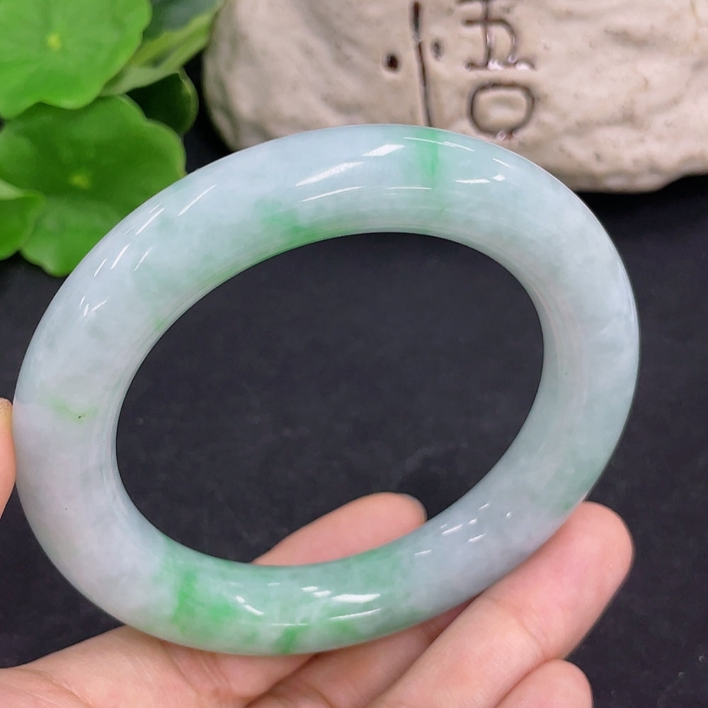 Jadeite round bangle in green jade with 80.5g weight and size 56.2, handcrafted by HKHQ, showing smooth, polished surface.