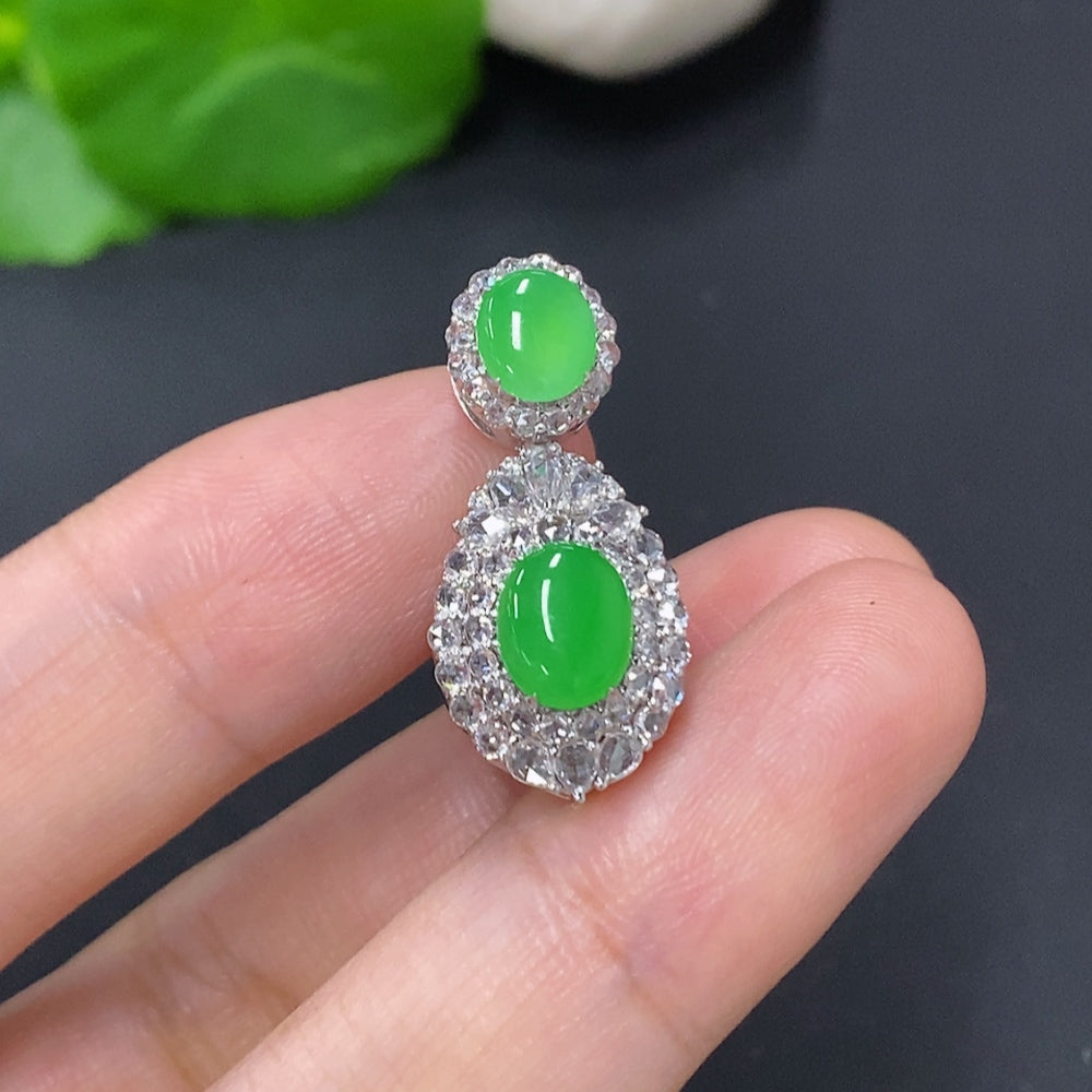 Jadeite cabochon pendant with diamond accents in 18K gold, showcasing a smooth, polished jade jadeite gemstone on a delicate gold setting.