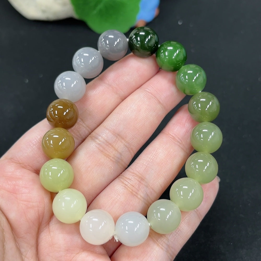 HKHQ Hetian Jade bracelet with smooth, polished green jade beads, weighs 45.6g, displayed on a neutral background.
