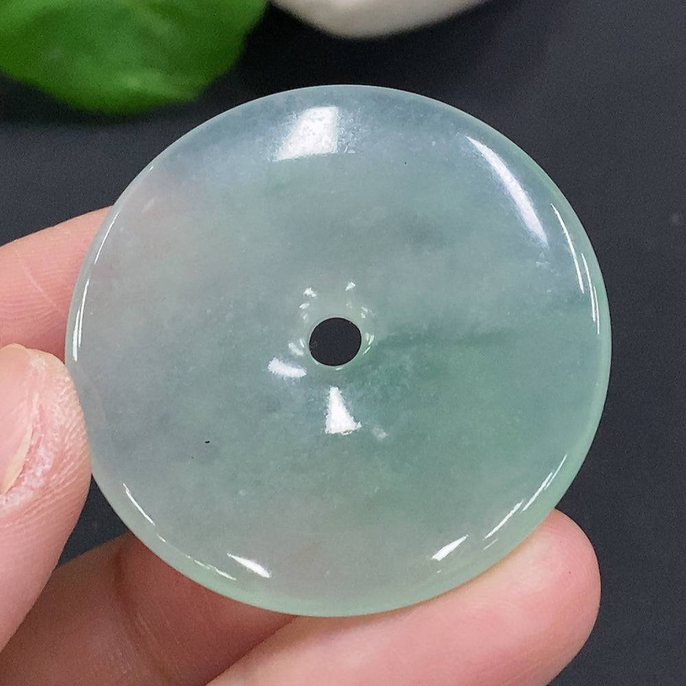Jadeite Peace Knot pendant from HUILIU HQ, approximately 17.4 grams, featuring a smooth jade stone with intricate knot design.