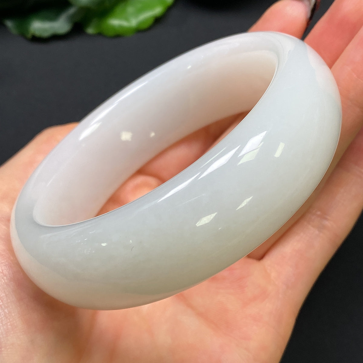 Round Hetian jade bracelet with a 59.6mm diameter and 112.13g weight, featuring smooth, polished green jade beads.