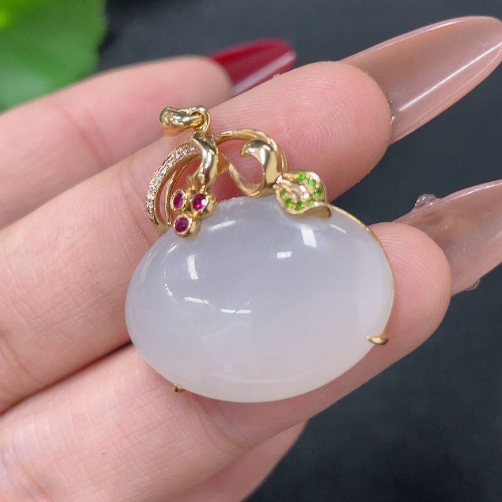 Huiliu Hetian jade pendant with diamond inlay, featuring a smooth, polished green jade stone and sparkling colorless diamonds.