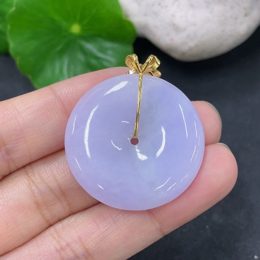 Jadeite pendant with peace buckle design, 18K gold accents, diamond details, by HKHQ, weighing approximately 9.9 grams.