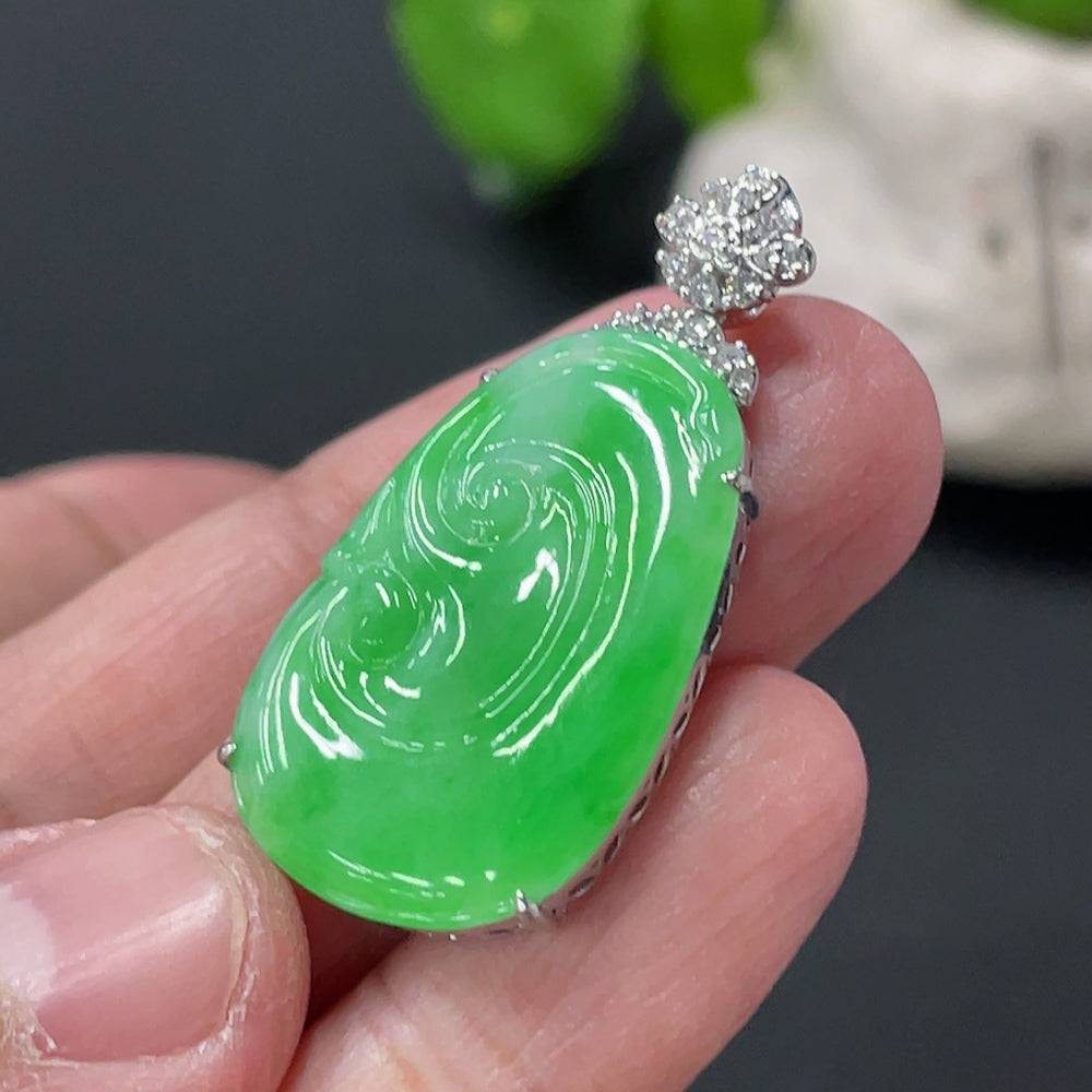 Jadeite Ruyi pendant with 18K gold inlay and diamond accents, displayed on a neutral background.