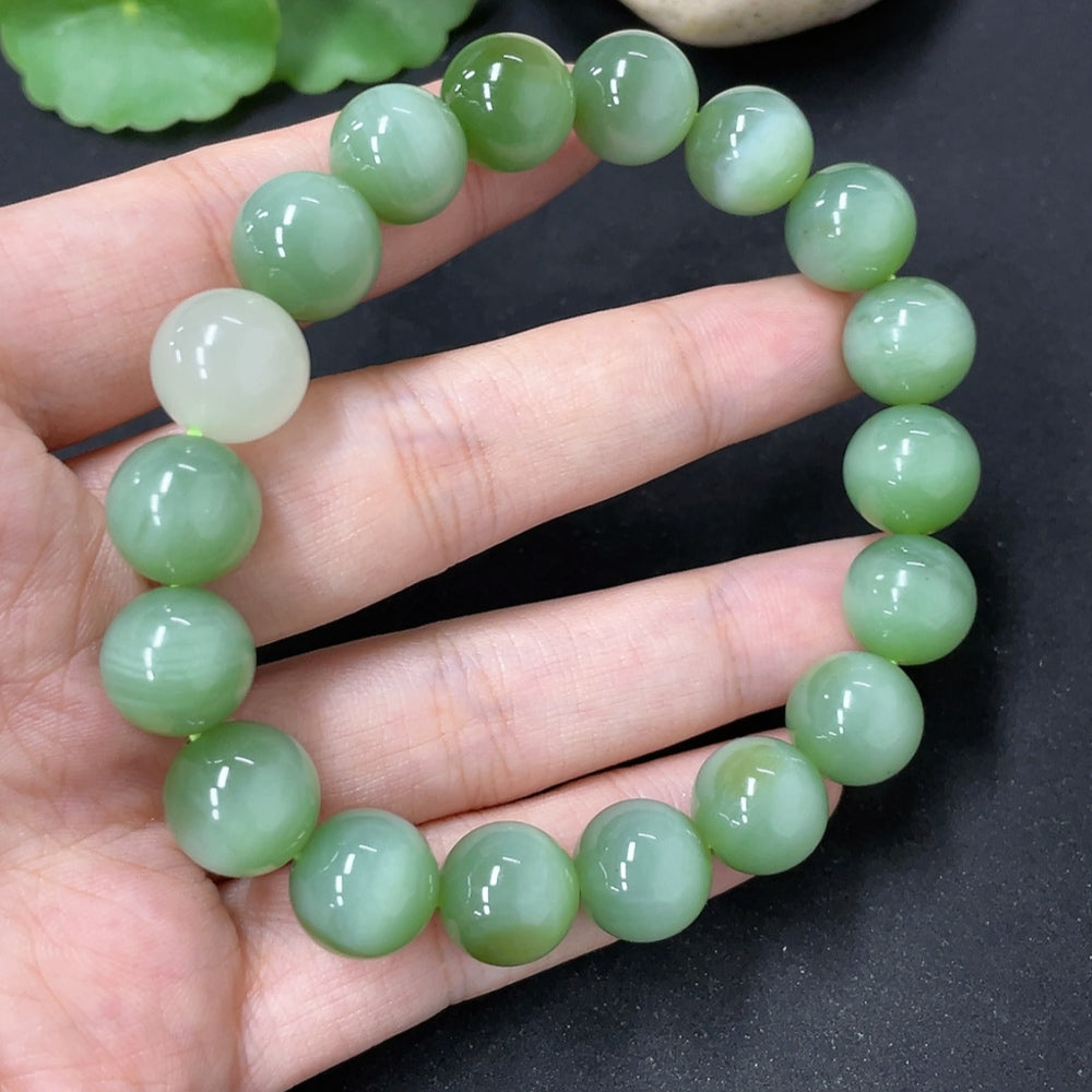 HKHQ Hetian Jade bracelet with smooth bead strands, showcasing natural green and white jade beads on a delicate jewelry bracelet.