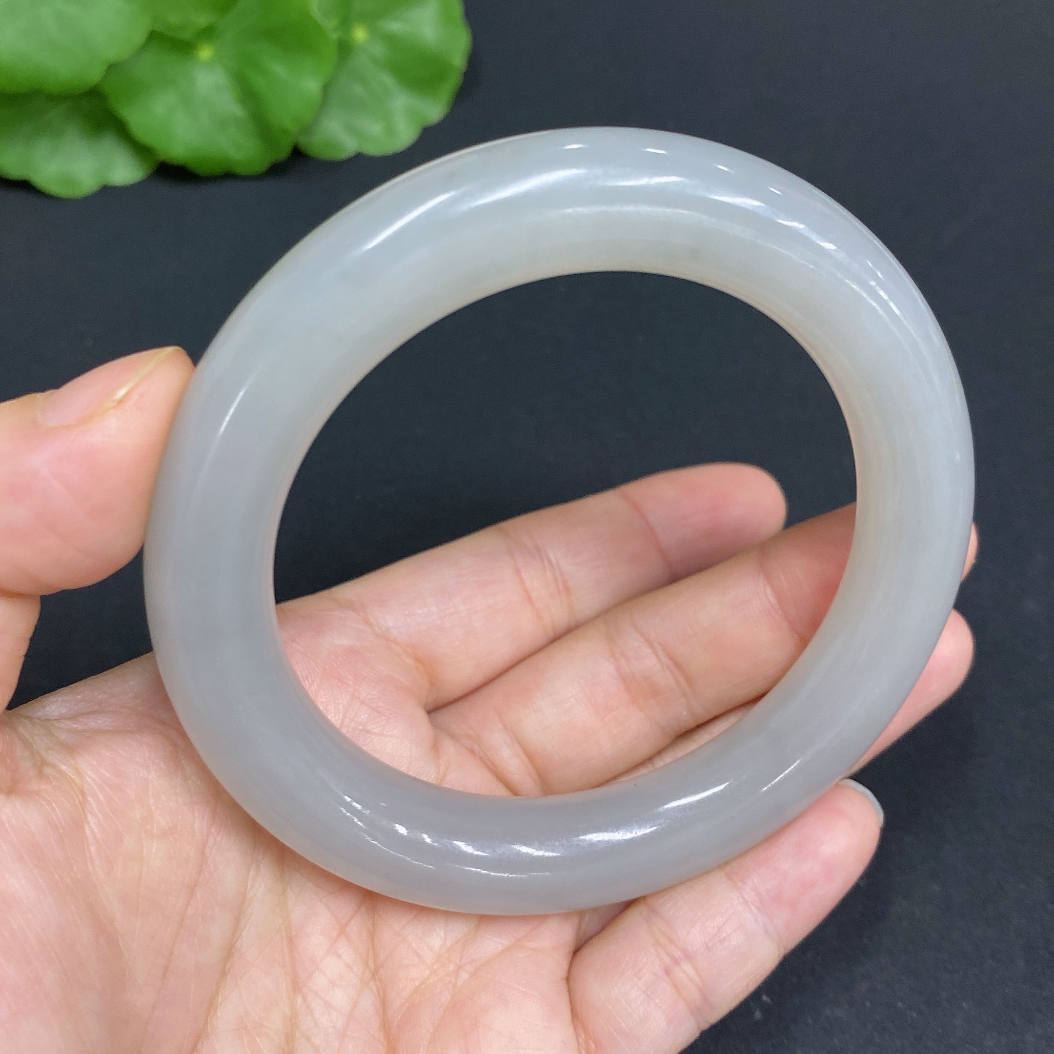 Huiliu certified Hetian jade round bangle, 58.3mm, featuring smooth polished surface and traditional craftsmanship.