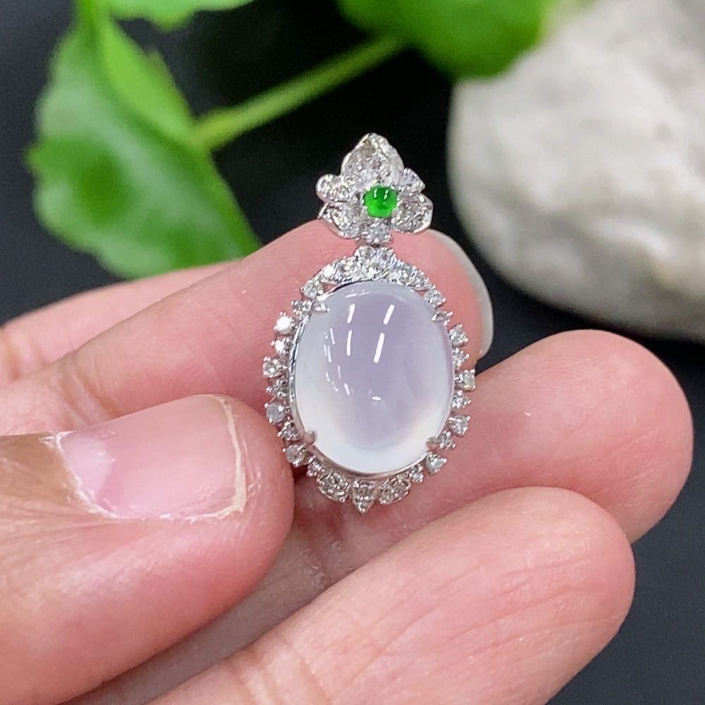 Jadeite cabochon pendant with 18K gold setting and diamond accents, featuring a polished green jade stone on a delicate chain.