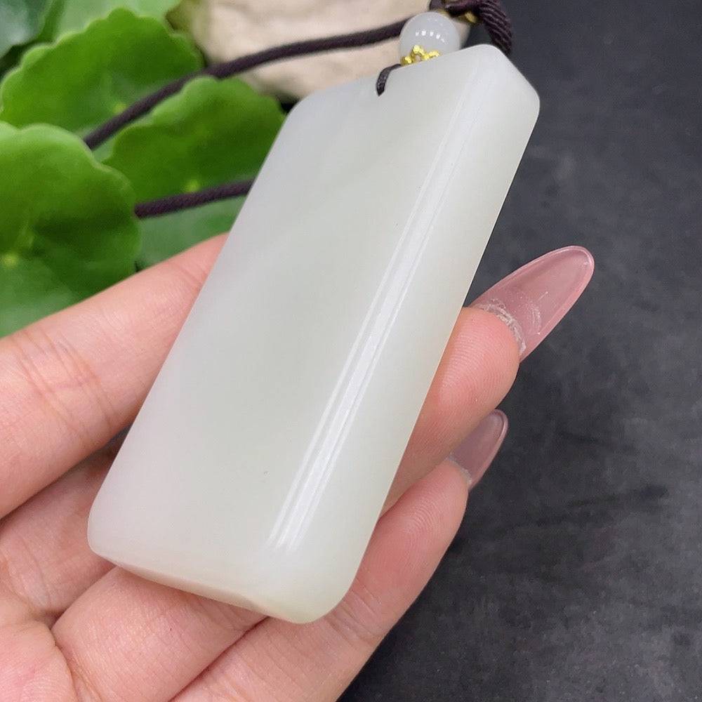 Huiliu HQ Hetian jade plain pendant, certified non-embellished jade jewelry with smooth surface and natural stone appearance.