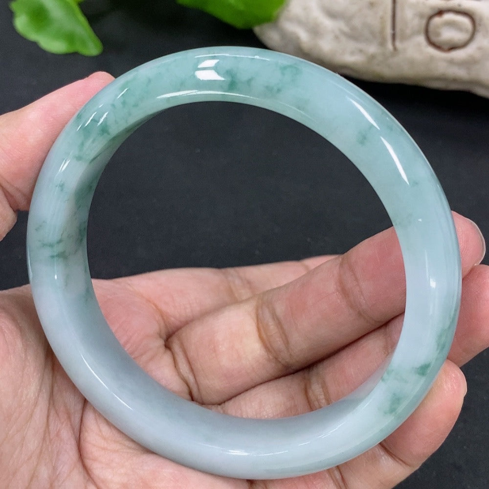 Jadeite round bangle with 59.2mm diameter, crafted by HKHQ, showcasing smooth, polished jade with a total weight of 57.62g.