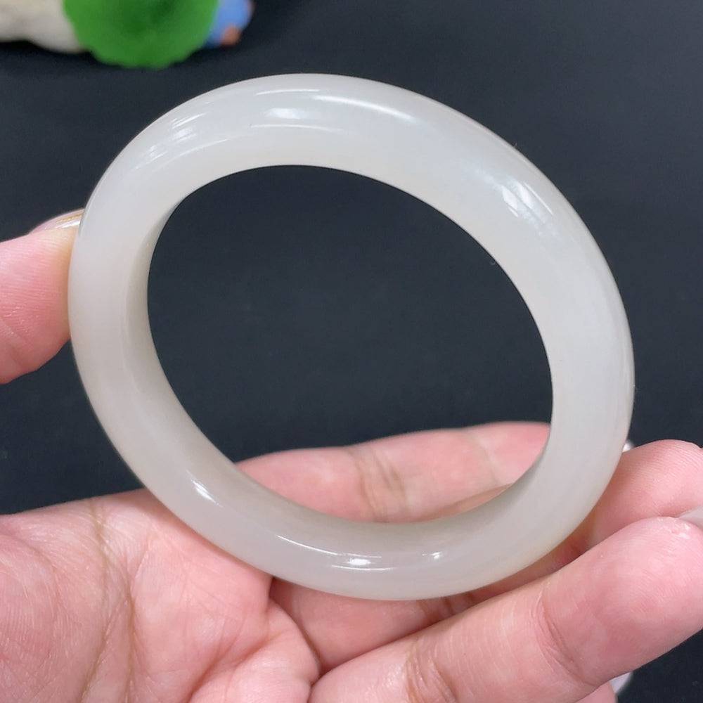 Huiliu certified Hetian jade round bracelet featuring smooth, polished jade beads on a string.