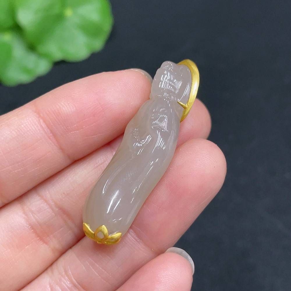 Huiliu certified Hetian jade Guanyin figure with intricate inlaid details, showcasing smooth jade craftsmanship and serene expression.