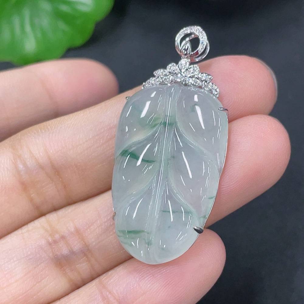 Jadeite leaf inlay pendant with 18K gold setting and diamond accents, from HUILIU HQ, weighing approximately 4.8g.