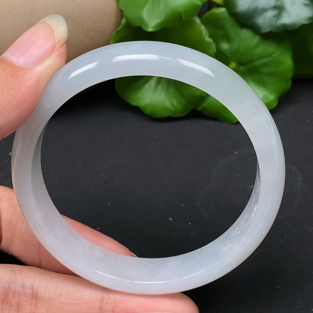 Jadeite round bangle in size 56.5 with a total weight of 43.17g, showcasing smooth, polished jadeite from HKHQ.