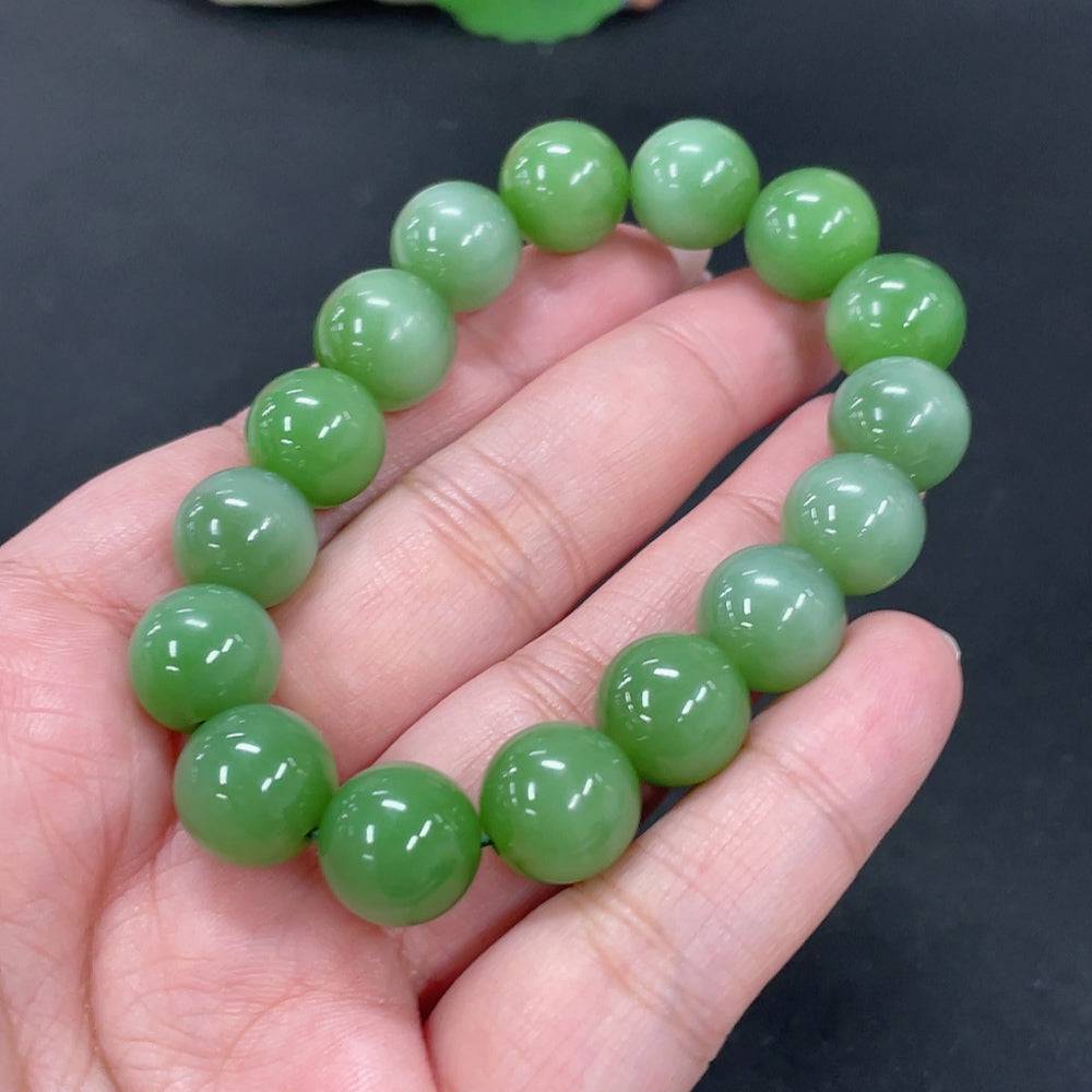 Hetian jade bracelet by HUILIU HQ featuring 12.4mm jade beads with a total weight of 43.8g, showcasing smooth, polished green jade.