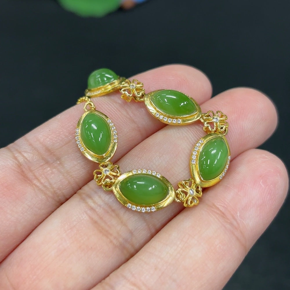 Hetian Jade Jasper inlaid bracelet by HKHQ featuring 18k gold accents, weighing approximately 4.3g, non-diamond jewelry piece.