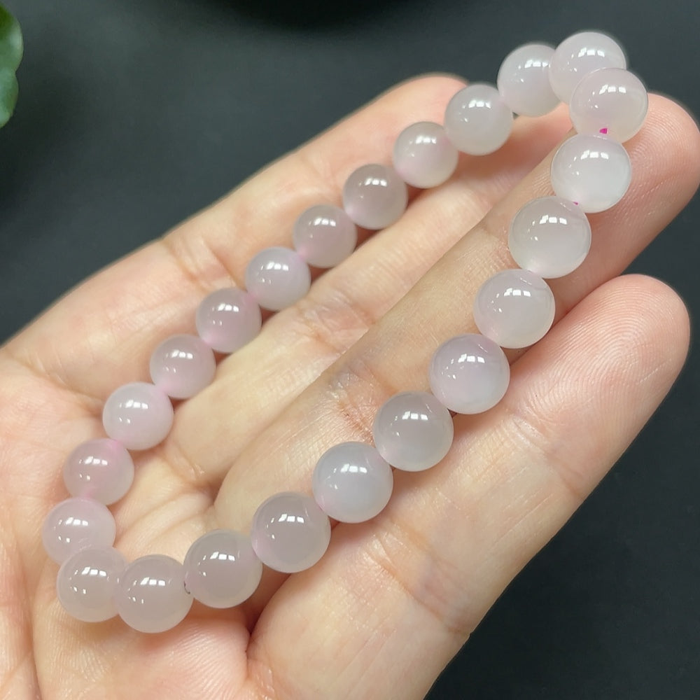 HKHQ Hetian Jade bracelet with 7.7mm round beads, showcasing smooth, polished green jade stones on a delicate bracelet.