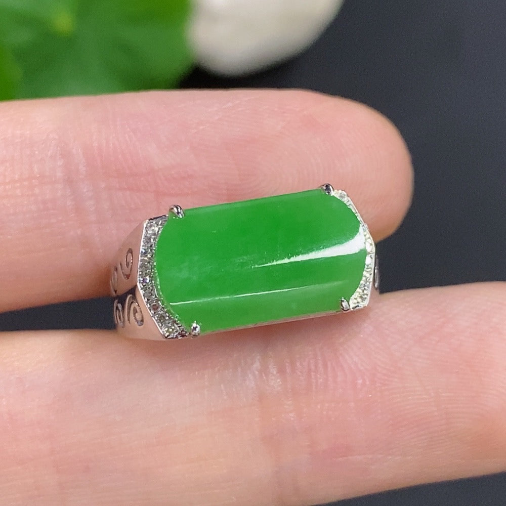 Jadeite cabochon ring in 18k gold with diamond accents, size 13, featuring a smooth green jade stone and gold band.