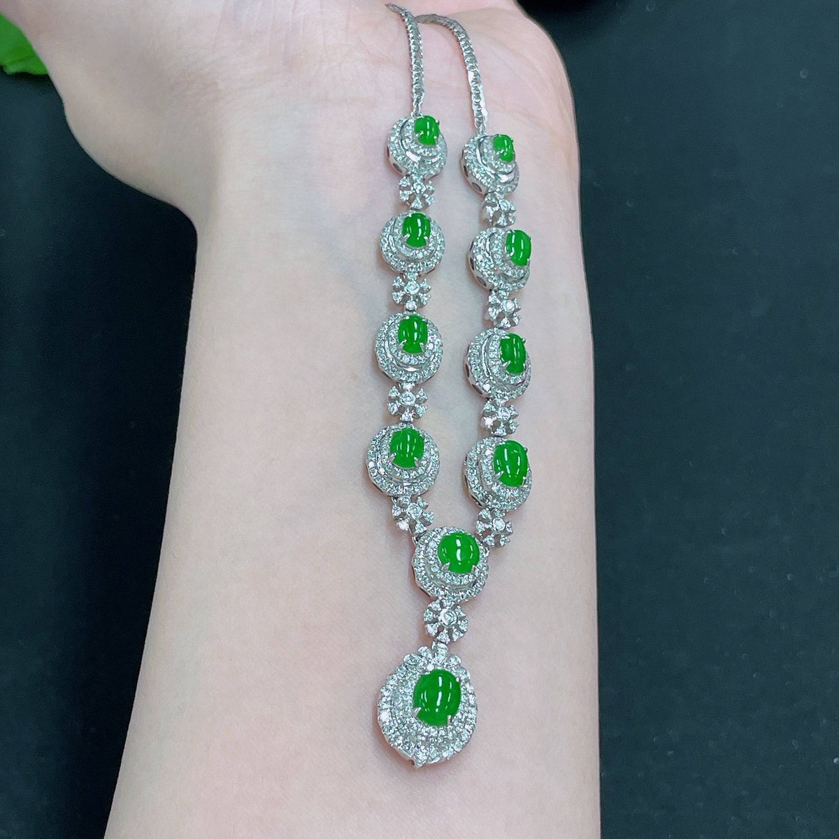 Huiliu jadeite necklace set with diamonds, featuring a elegant jade pendant and matching earrings, certified by Huiliu HQ.