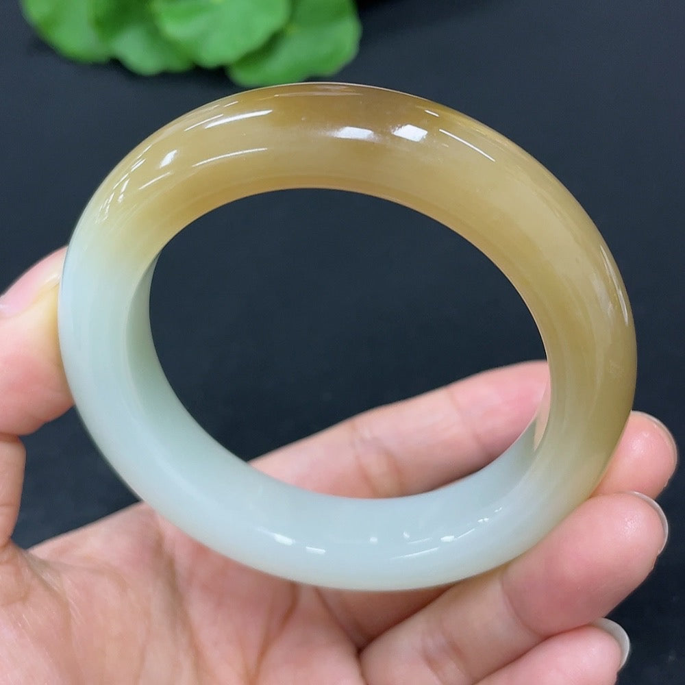 Hetian jade round bangle bracelet from HKHQ, size 51.3, polished smooth surface, showcasing elegant, natural green jade color.