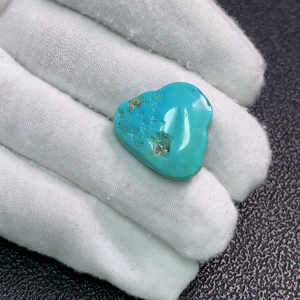 Turquoise inlay, color origin undetermined, containing other mineral components, total weight approximately 4.43 grams