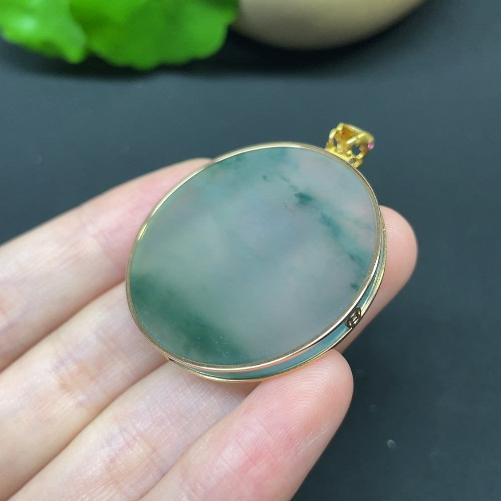 Jadeite round pendant necklace with 18K gold and diamond accents, elegant jewelry piece featuring a polished jadeite gemstone.