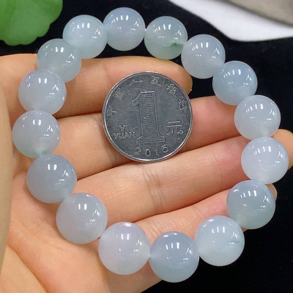 Jadeite bracelet with 12.1mm beads, weighing approximately 51.08g, from HUILIU HQ, displayed on a neutral background.