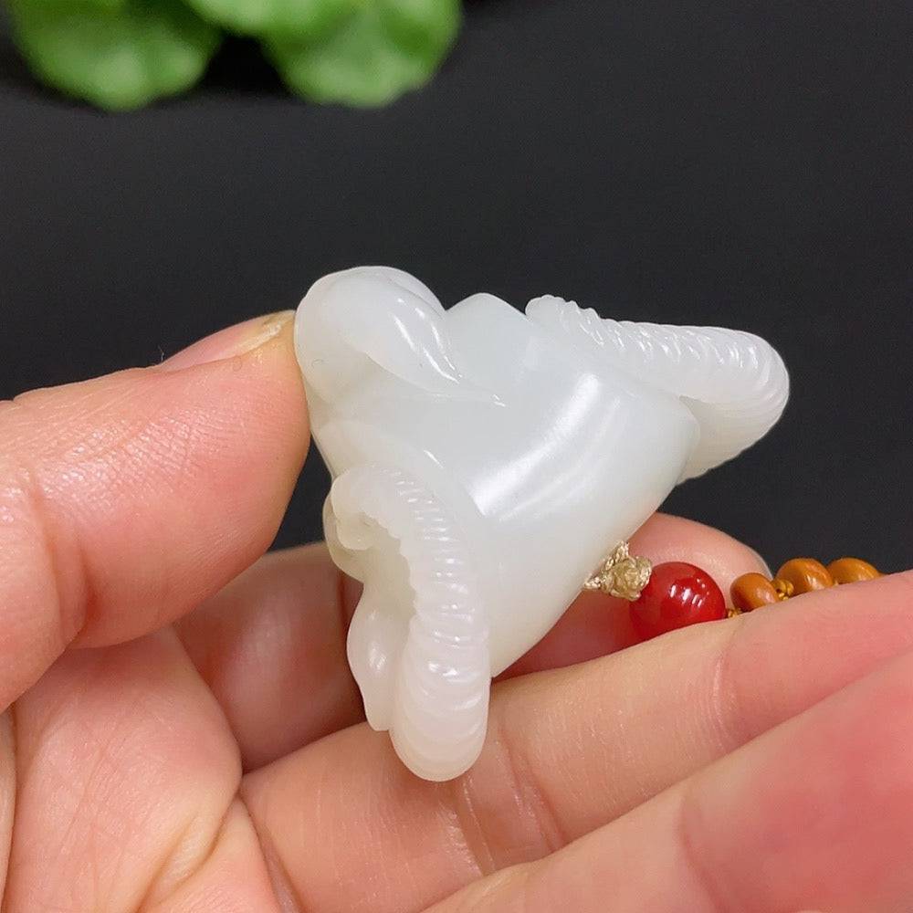 Huiliu HQ Hetian jade pendant featuring an auspicious ram design, certified Huiliu jade, intricate craftsmanship, natural green and beige tones.