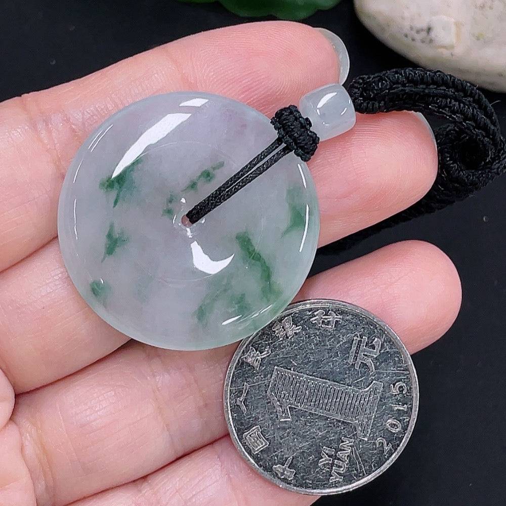 Jadeite Peace Knot pendant from HUILIU HQ, showcasing a polished jade jade with intricate knot design on a rope.