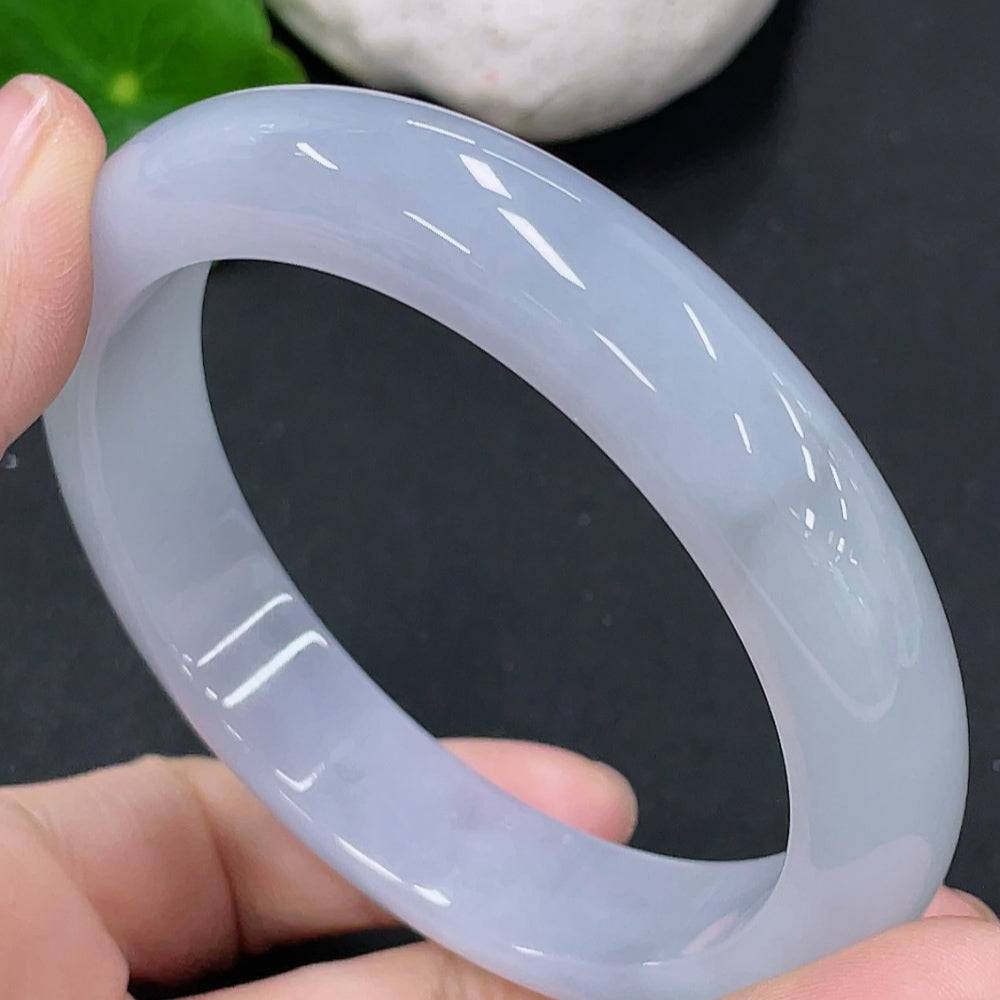 Huiliu certified jadeite round bangle showcasing smooth, polished green jade with a glossy finish on a plain background.