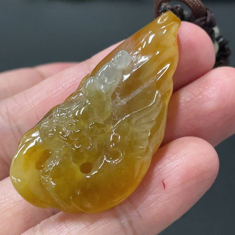 Huiliu Jadeite Enlightenment Pendant showing a smooth, polished jade pendant with natural green hues on a white background.