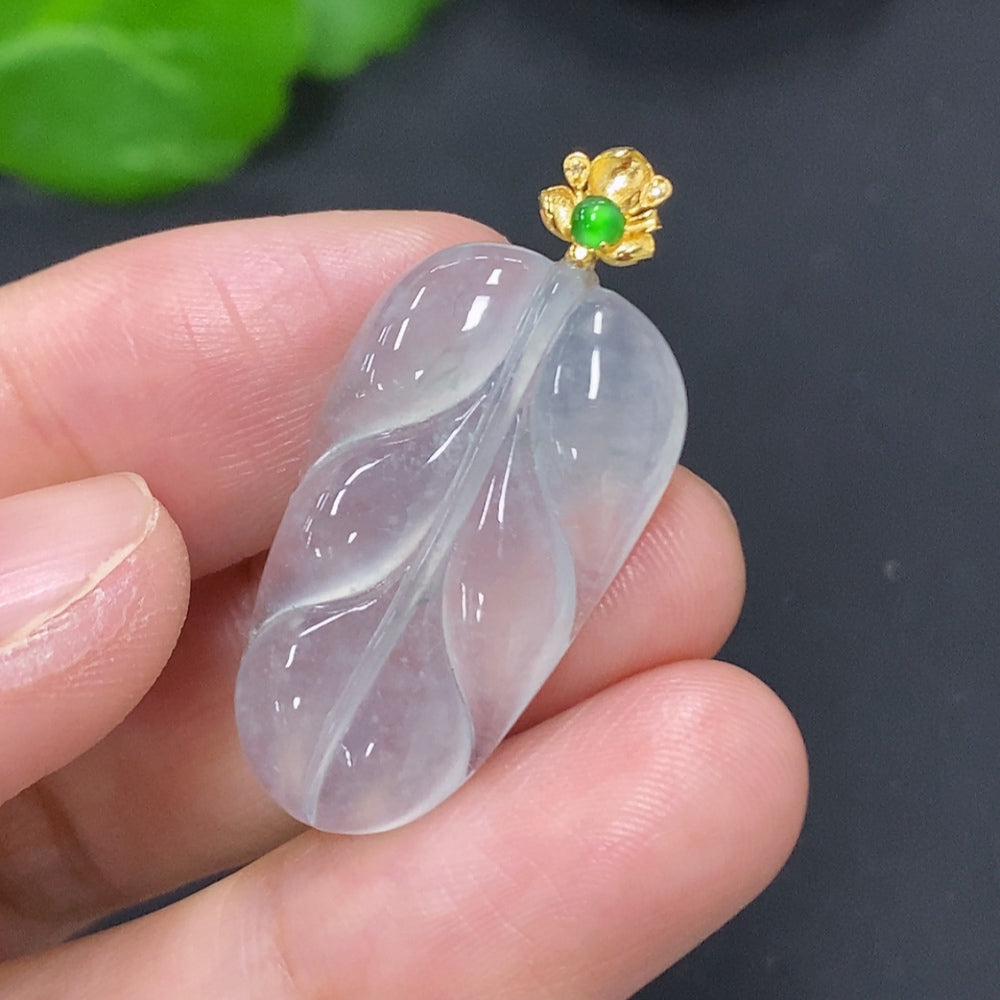 Jadeite leaf pendant with 18K gold clasp, crafted from green jade, weighing approximately 3.9g, displayed on a neutral background.