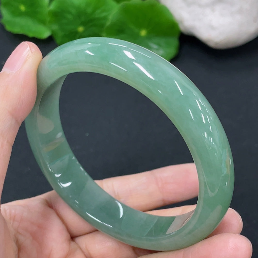Jadeite round bangle with a total weight of 54.38g and size 56.9, crafted by HKHQ, showcasing smooth, polished jade jewelry