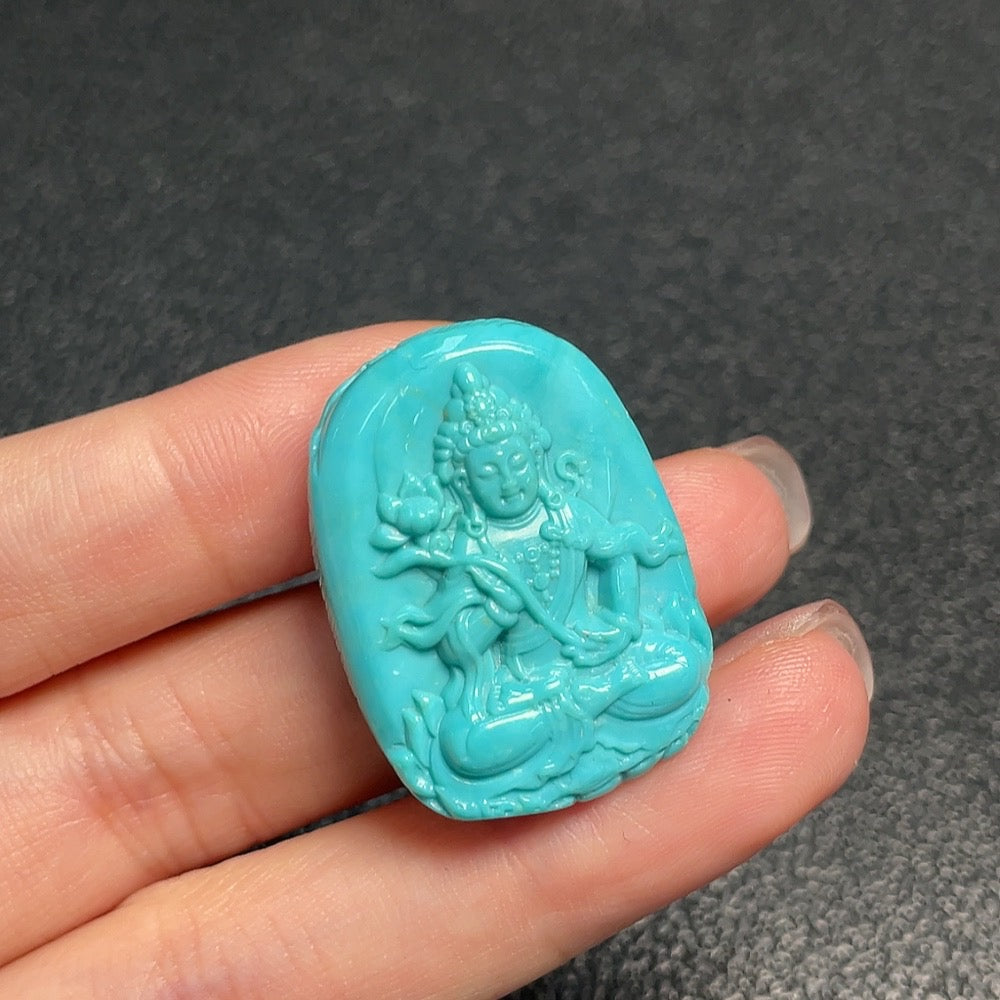 Turquoise gemstone pendant from HUILIU HQ, weighs approximately 10.2g, featuring a vibrant blue-green stone with intricate design details.