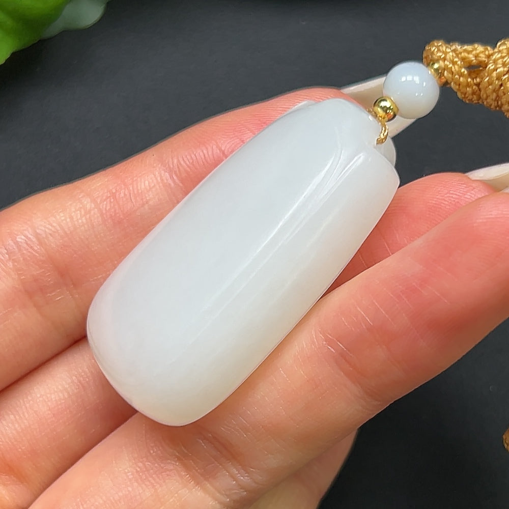 HKHQ Hetian Jade plain pendant weighing 27.31g with rope, showcasing smooth, polished jade stone and simple elegant design.