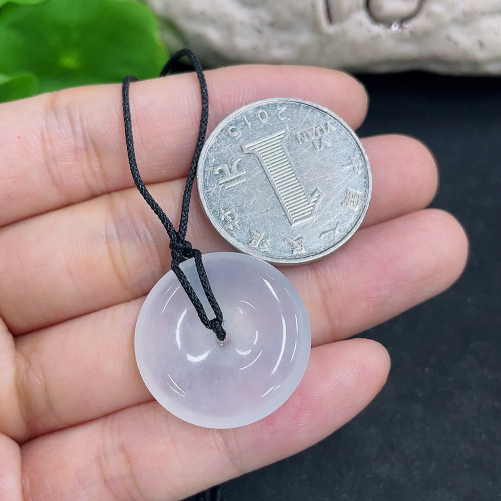 Jadeite pendant necklace with a polished green jade pendant, branded HKHQ, weighing approximately 6.8 grams.