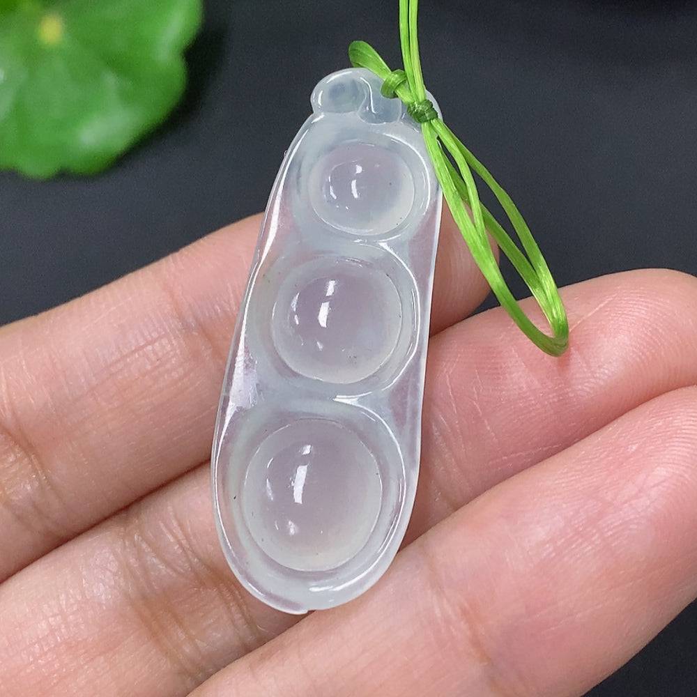 Huiliu Jadeite Lucky Bean Pendant featuring vibrant green jade, polished smooth, with carved detailing, on a silver chain.