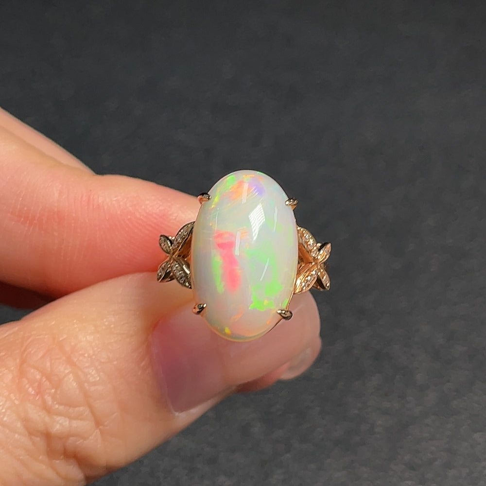 Opal ring with diamond accents, 73% gold content, total weight approximately 3 grams, size 11