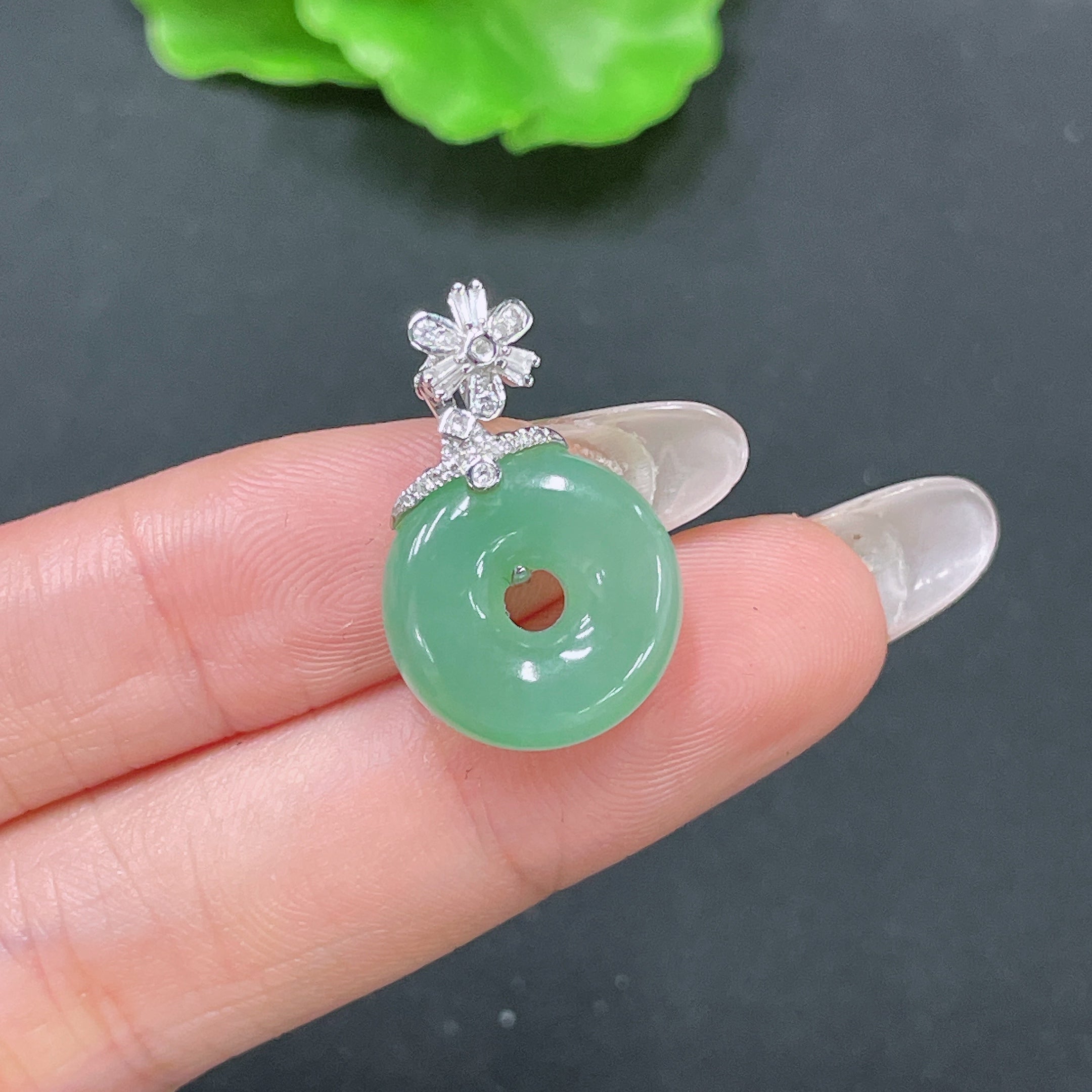 HUILIU HQ jadeite pendant with peace knot design, 18k gold inlay, diamond accents, showcasing intricate craftsmanship.
