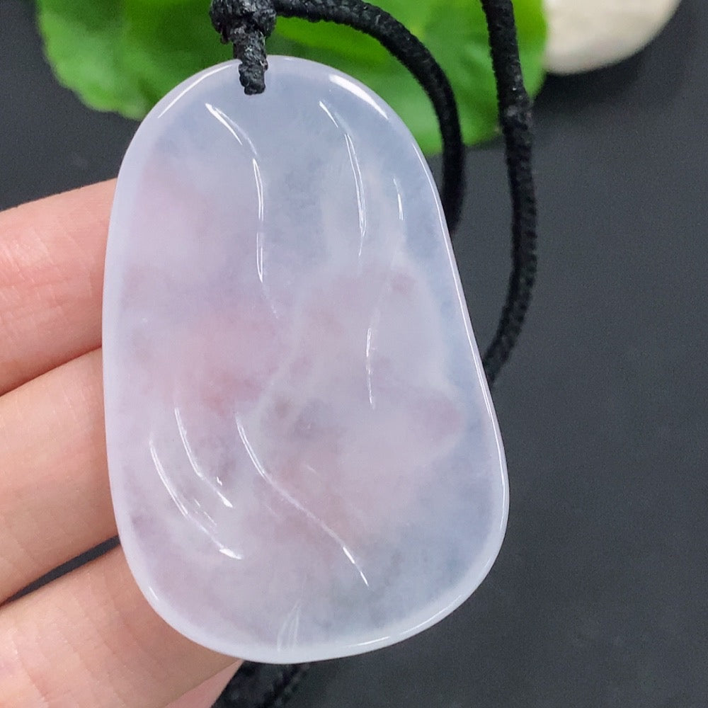 Jadeite Guanyin pendant with a carved figure, weighing approximately 25.3g, featuring a jade HUILIU HQ brand pendant on a rope.