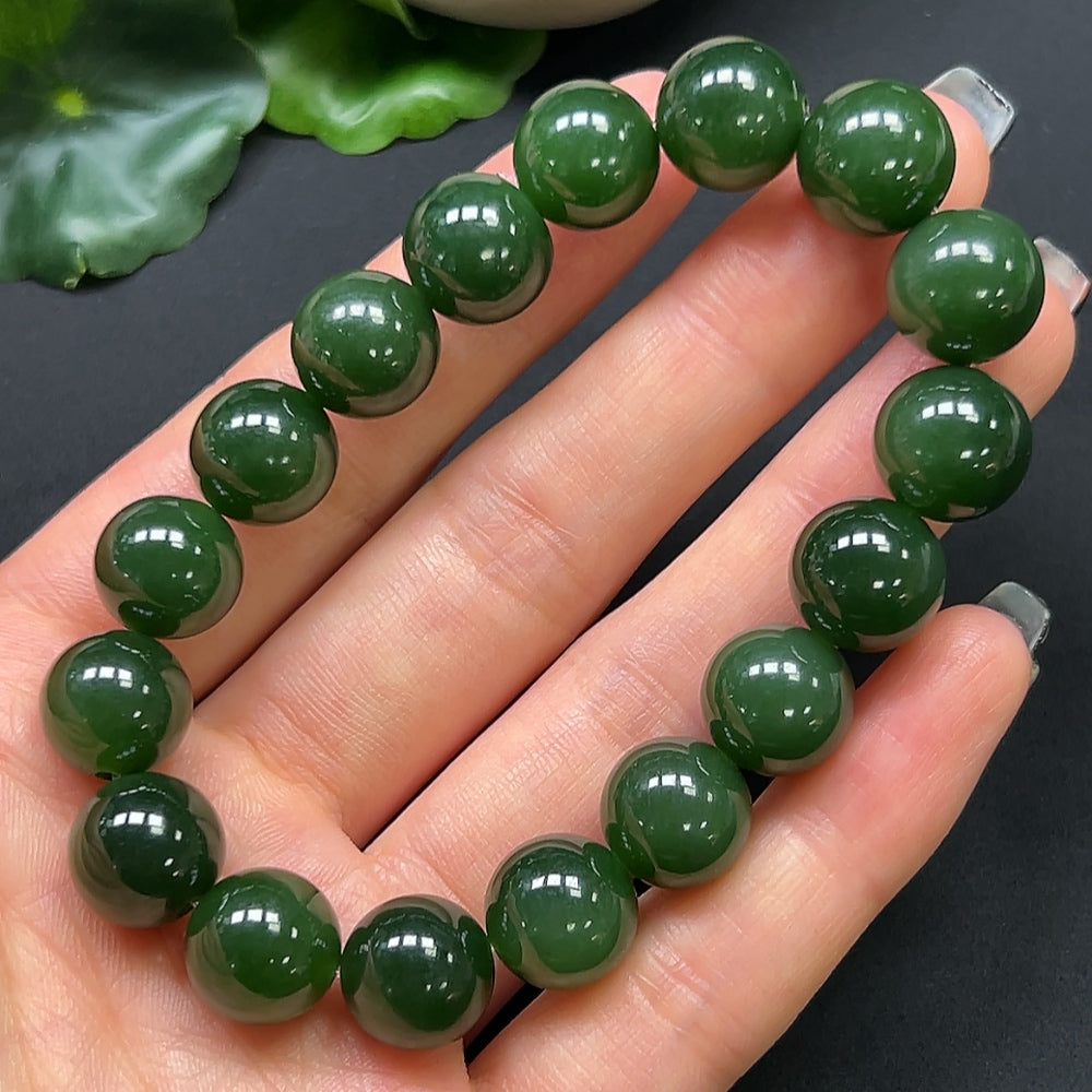 HKHQ Hetian Jade bracelet with 12mm beads and a total weight of 44.19g, showcasing smooth, polished green jade beads.
